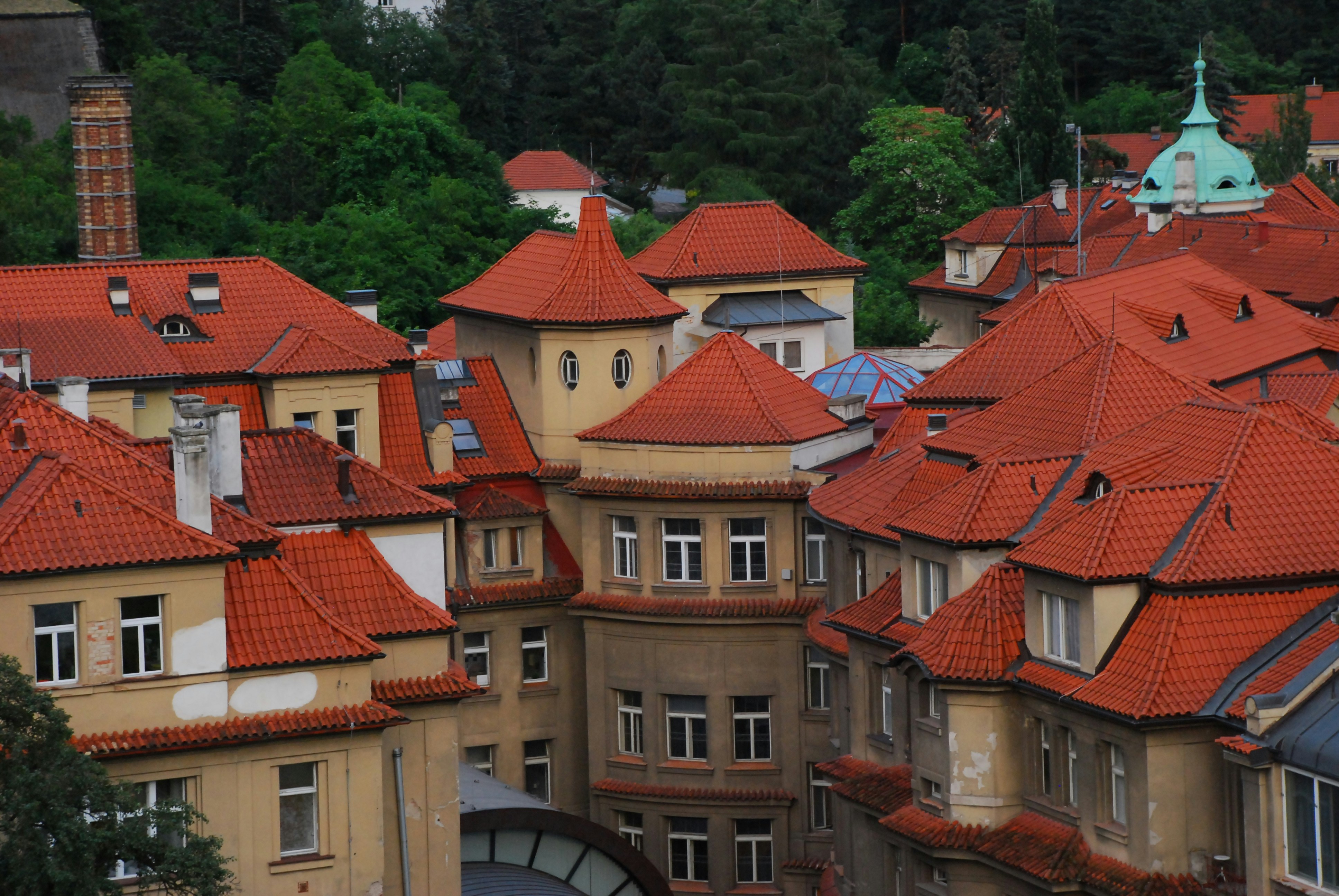 a group of buildings with red roofs