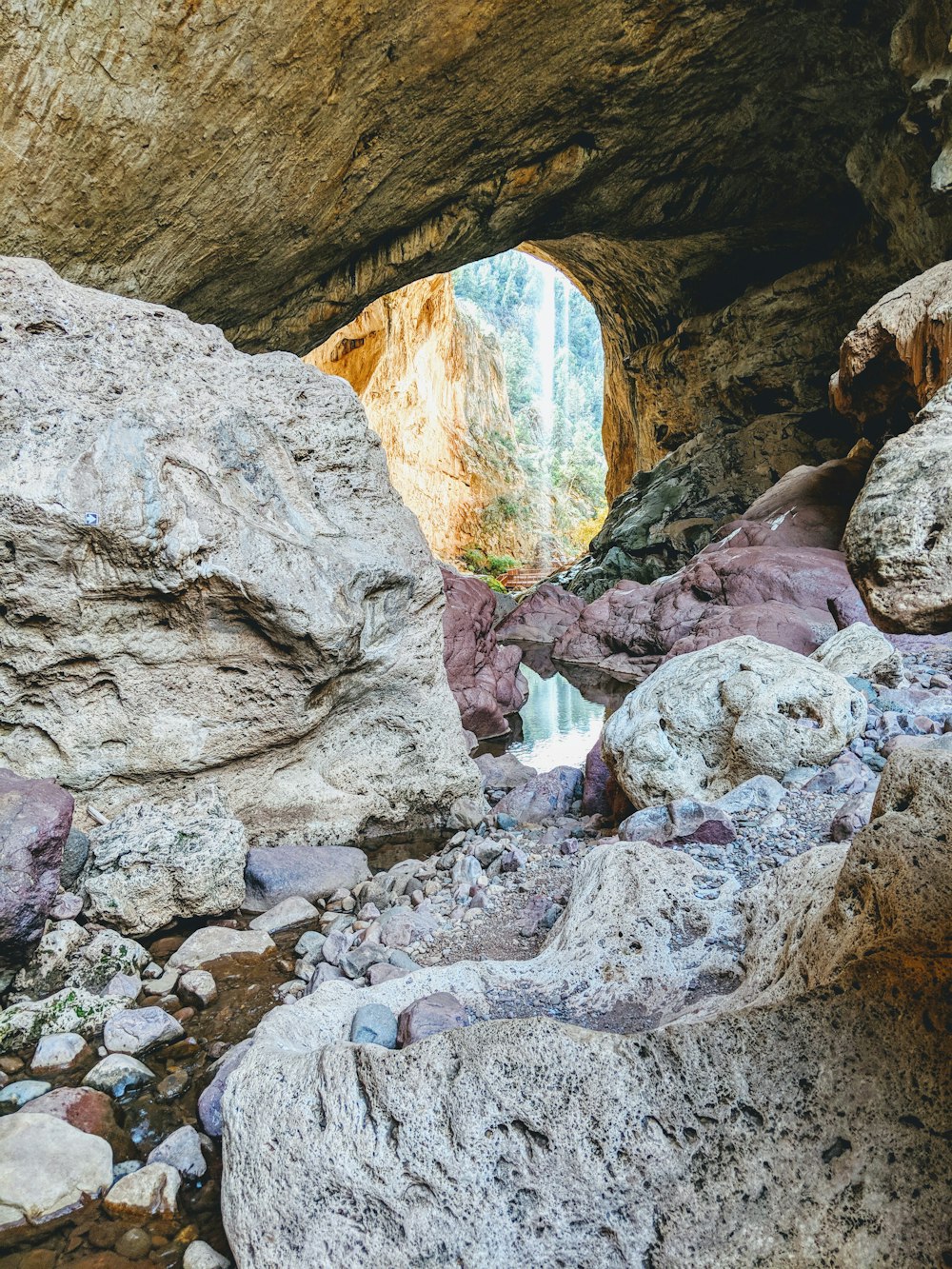 a rock cave with a hole in it