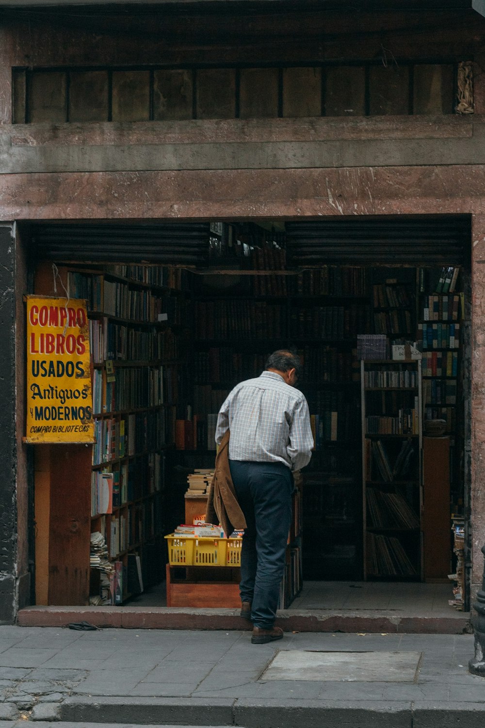 a man standing outside a store