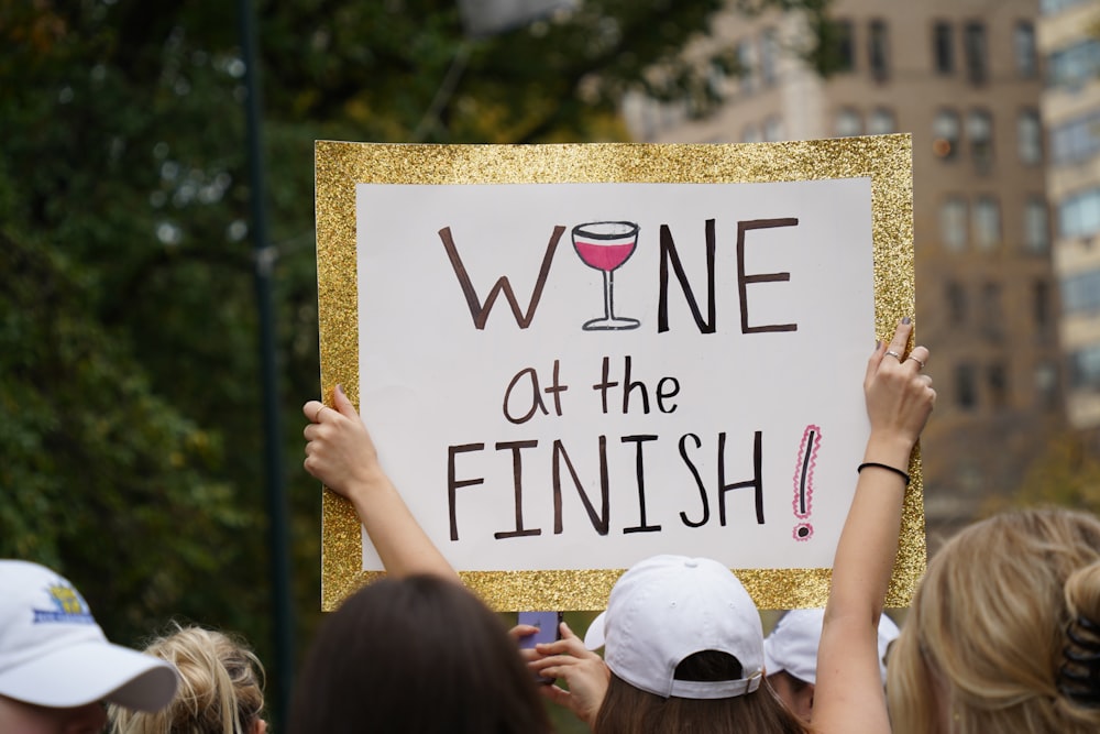 a group of people holding a sign