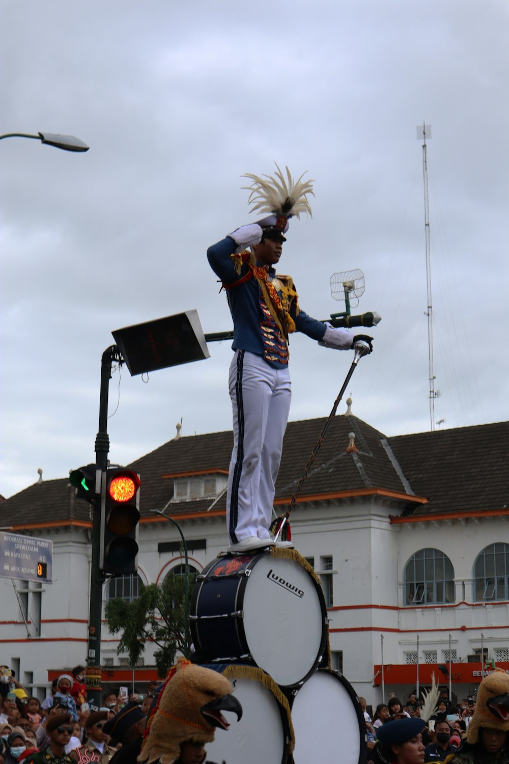 a person playing drums on a street