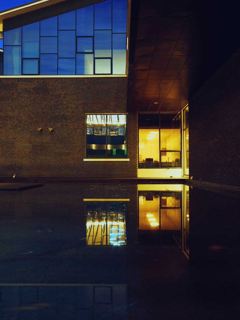 a building with windows and a light on the side