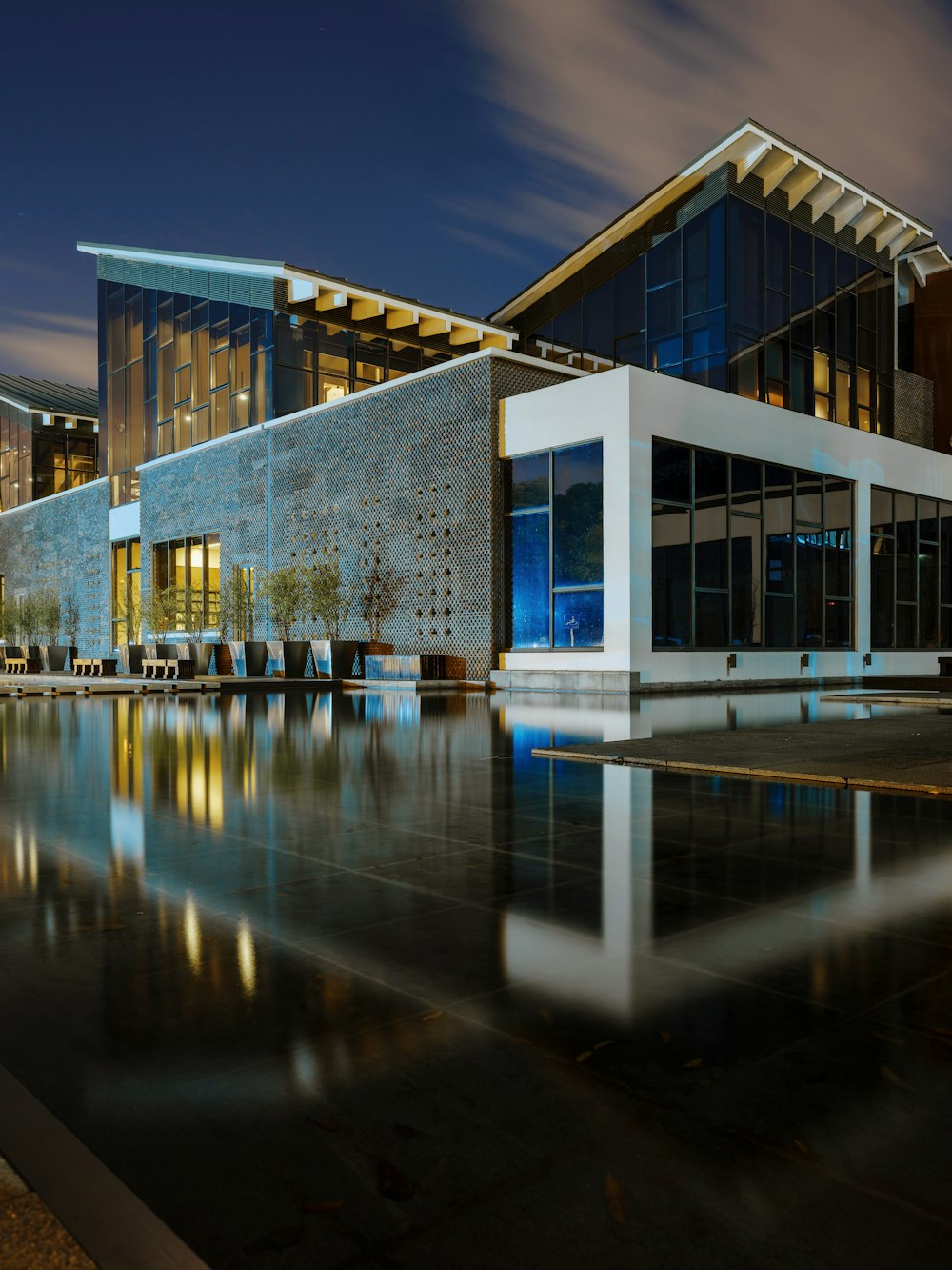 a building with a pool in front of it