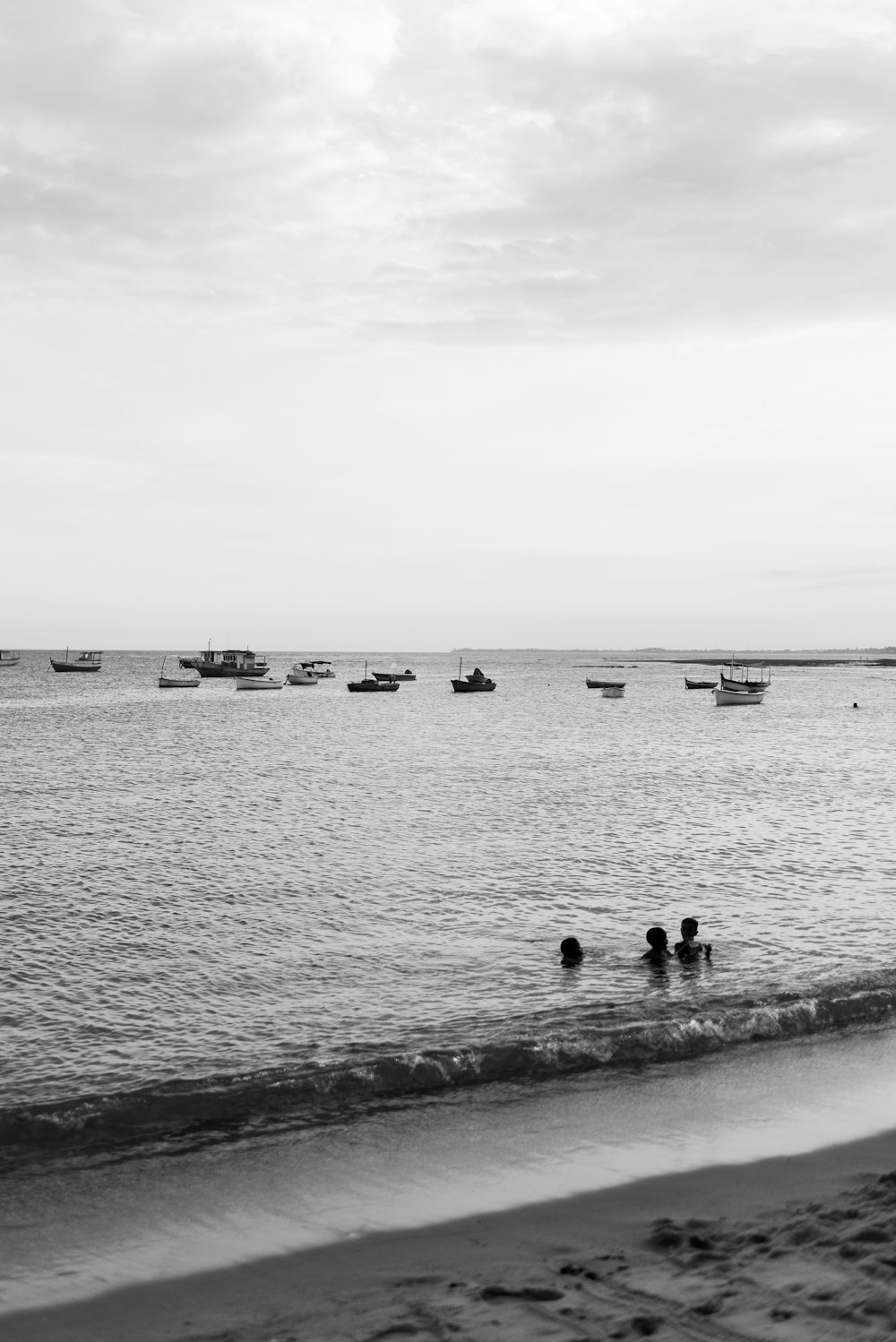 a group of people swimming in the ocean