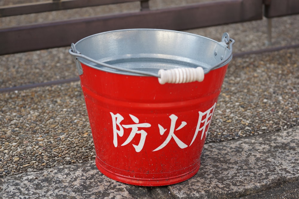 a red plastic bucket