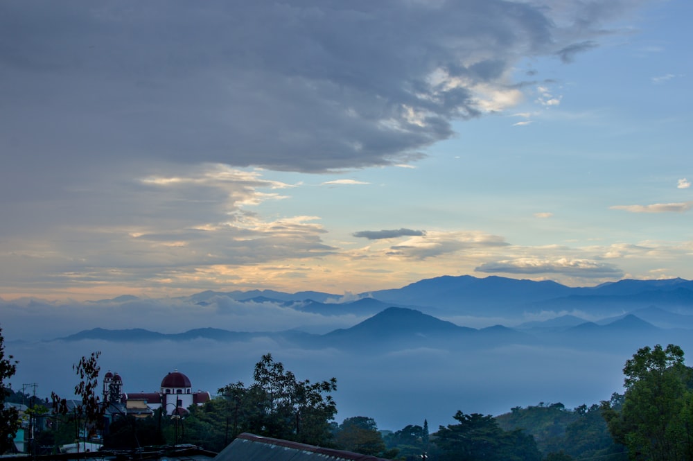 a view of mountains and trees