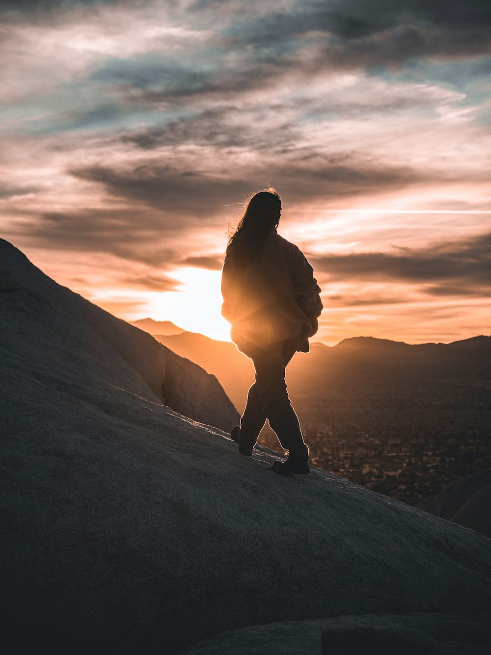 a person standing on a mountain