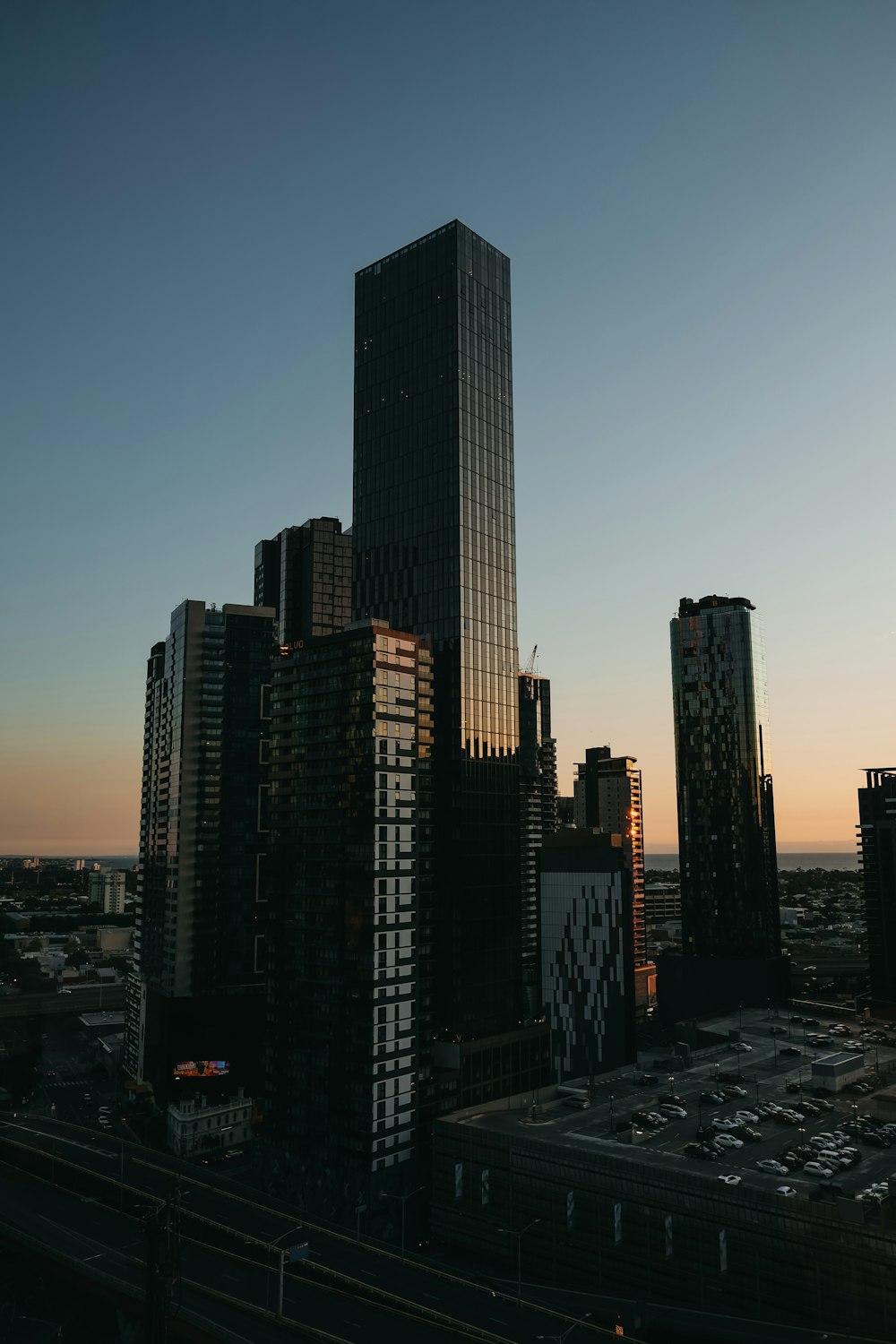 a city skyline with tall buildings