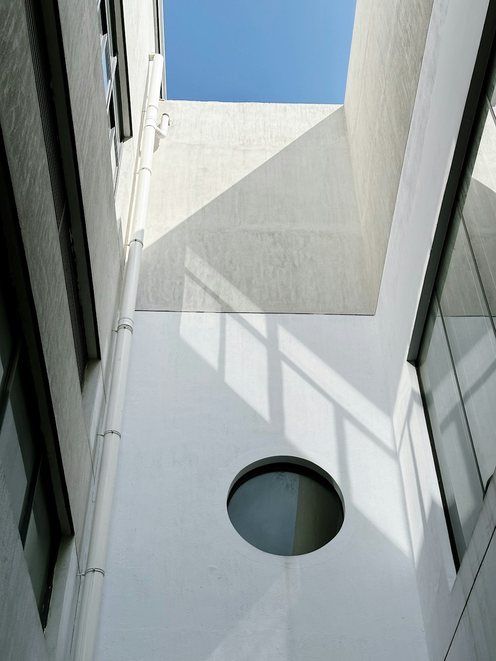 a white building with a round window