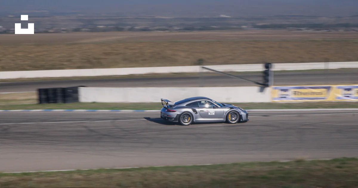 A car on a race track photo – Free Rustavi Image on Unsplash