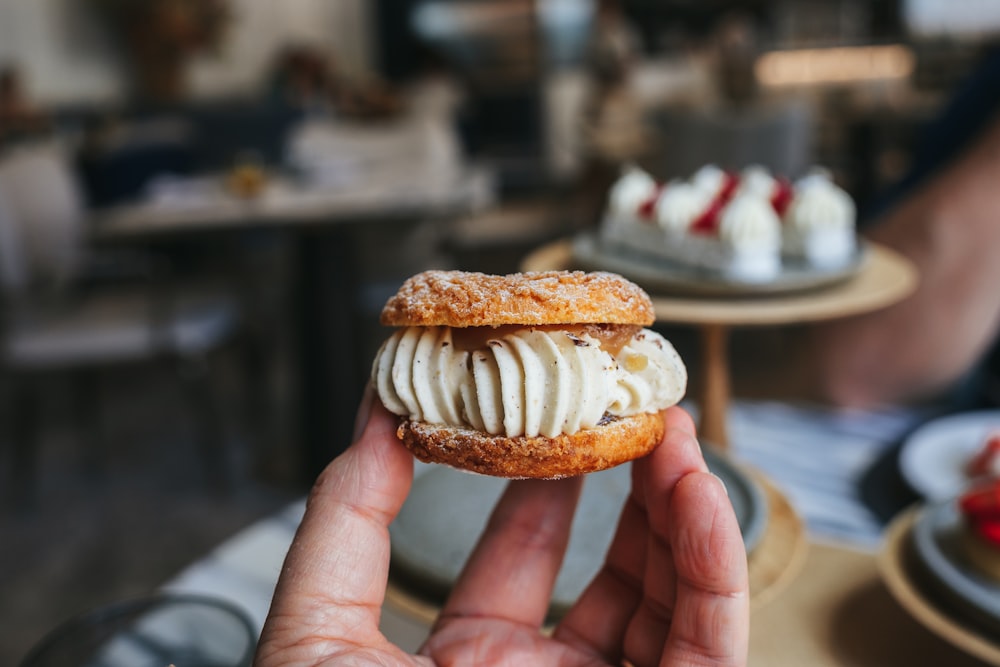 a person holding a pastry