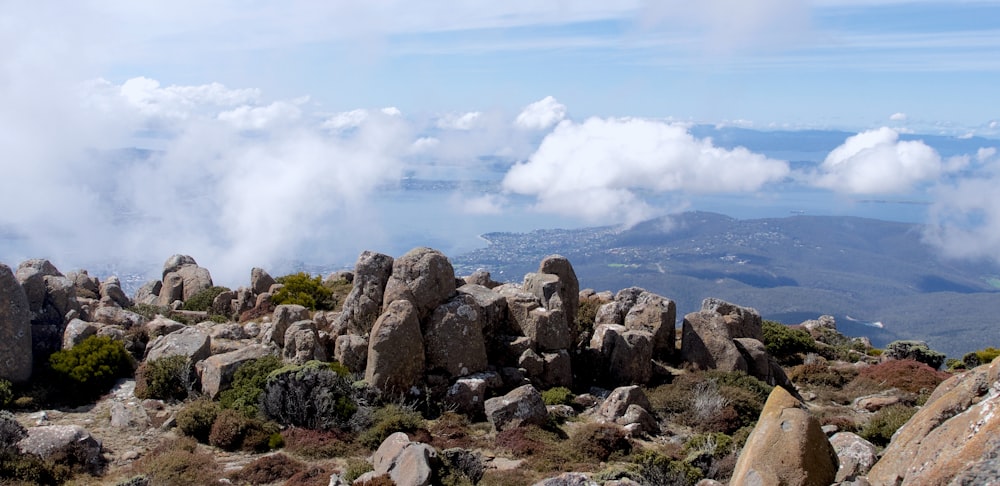 a rocky landscape with clouds in the background