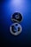 Two Ethereum coins with a metallic surface lie against a dark blue background. The top coin displays the Ethereum logo and text, while the bottom coin highlights the phrases 'decentralized platform' and 'smart contracts'.