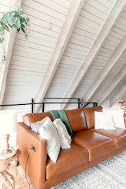 A cozy living room showcasing a blend of wood, metal, and fabric textures creating a warm, inviting atmosphere.
