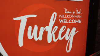 A welcoming office entrance with signage in Turkish and English.
