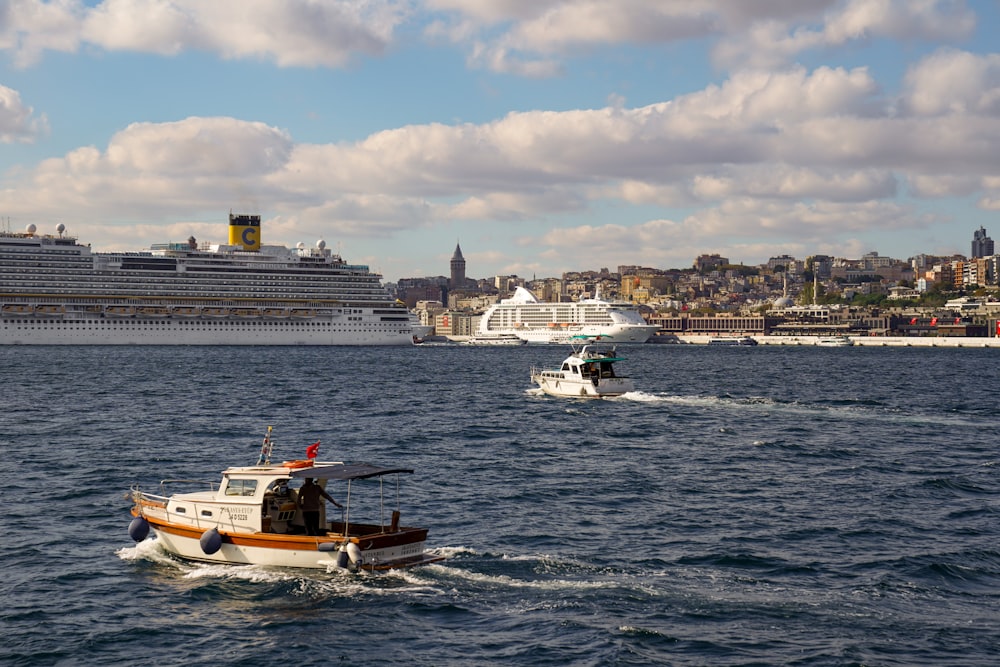 a group of boats are sailing in the water