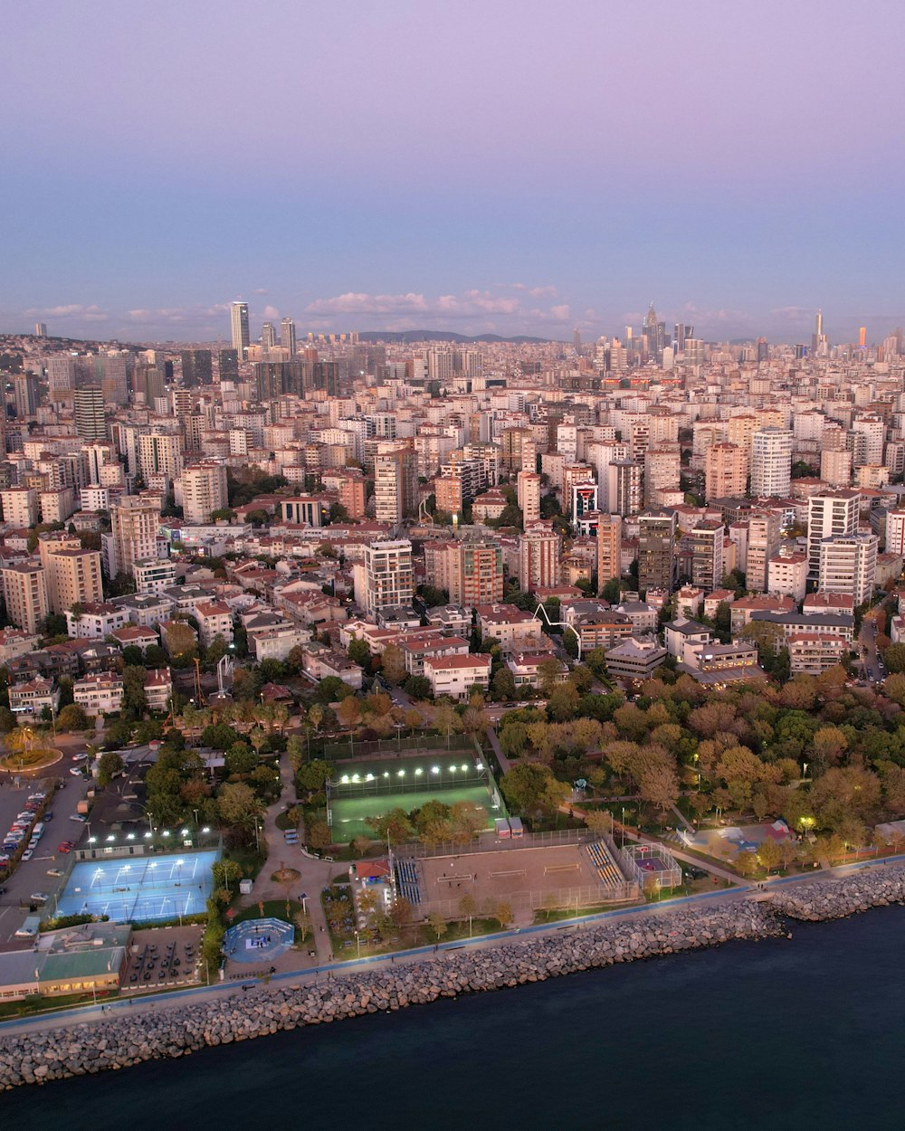 a city with a pool and a large body of water