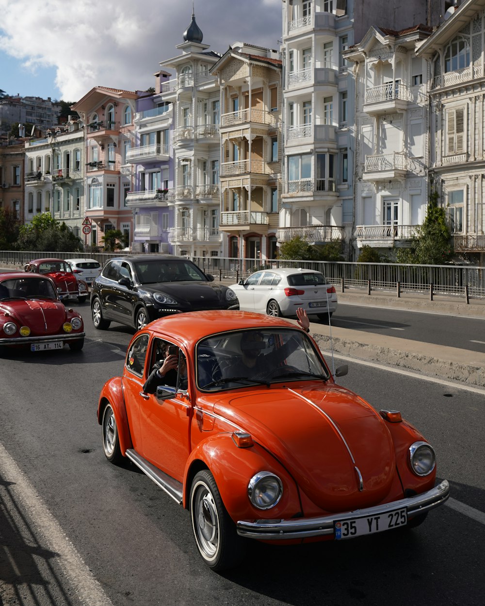 a group of cars parked on the side of a road