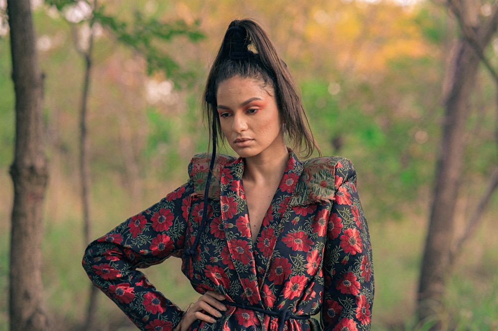 a woman in a floral shirt