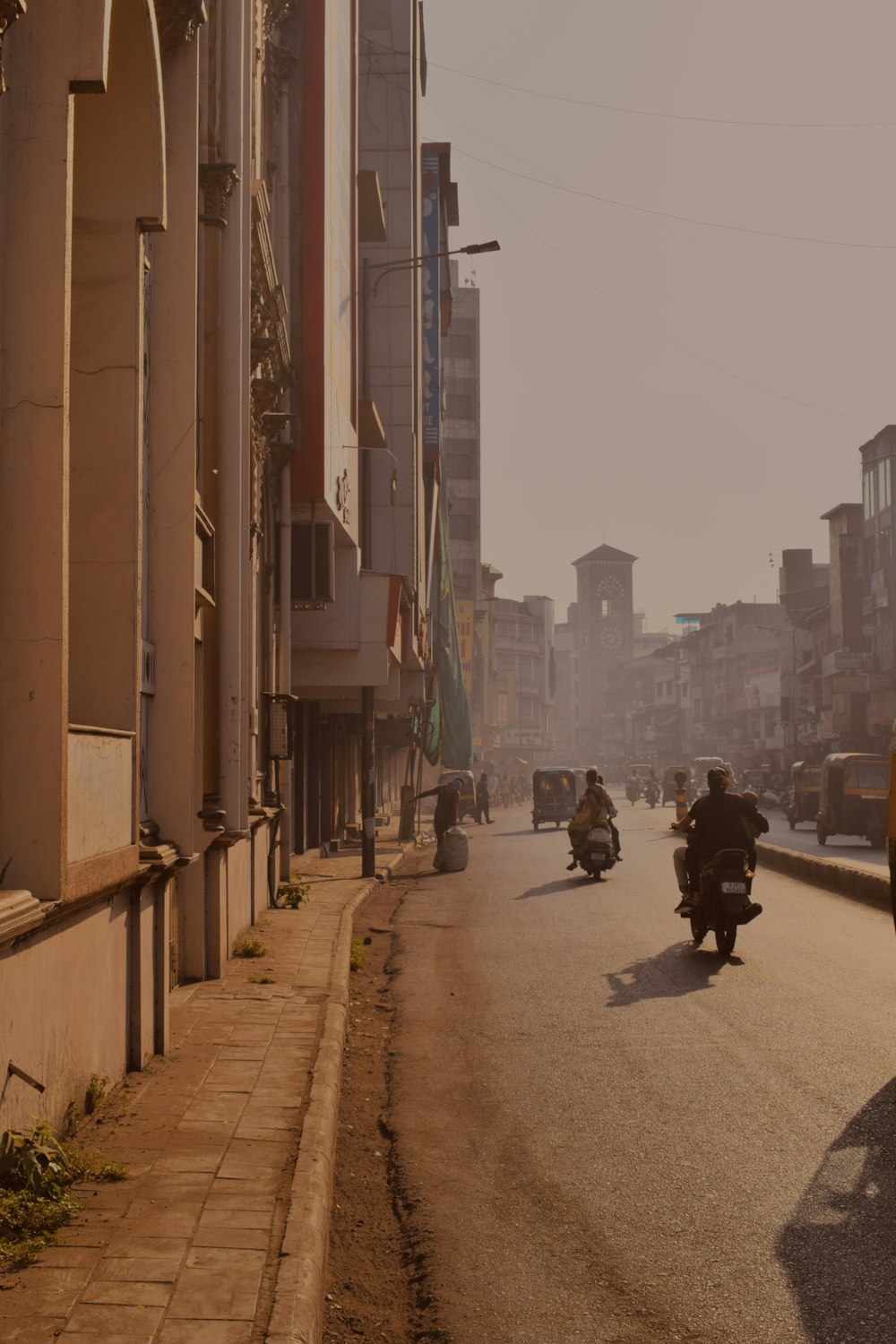 a person riding a motorcycle down a street