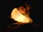 A cozy bedroom with a softly glowing nightlight and a mother holding a sleeping child.
