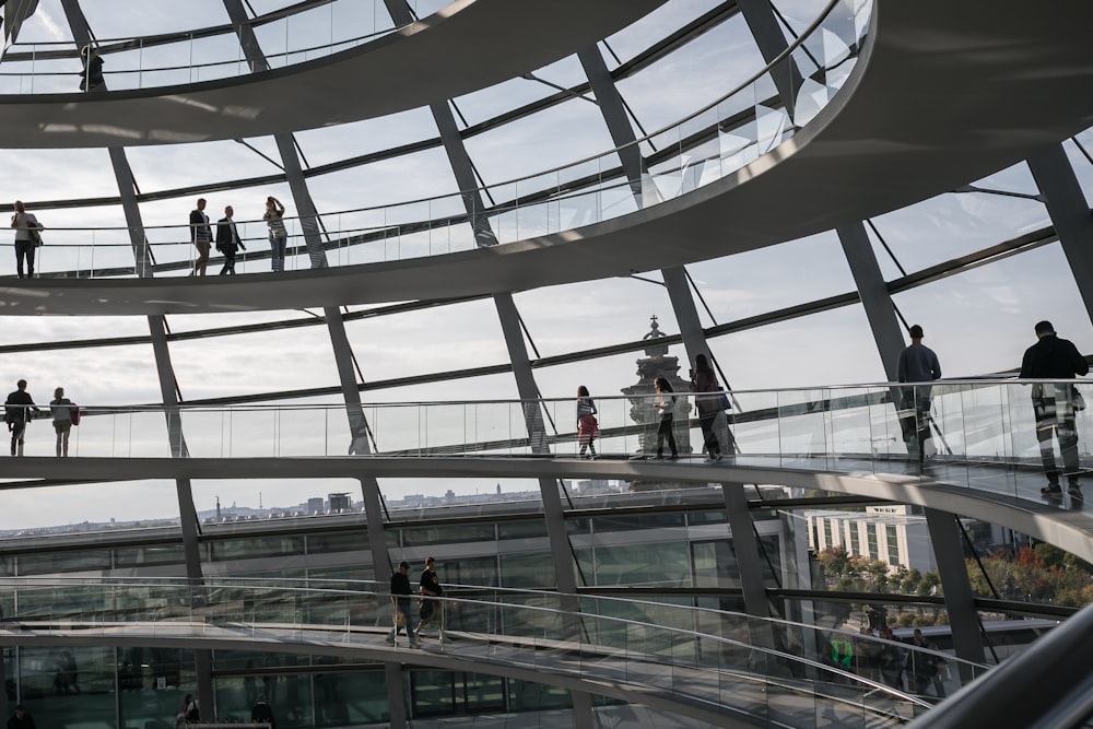 a group of people walking on a bridge