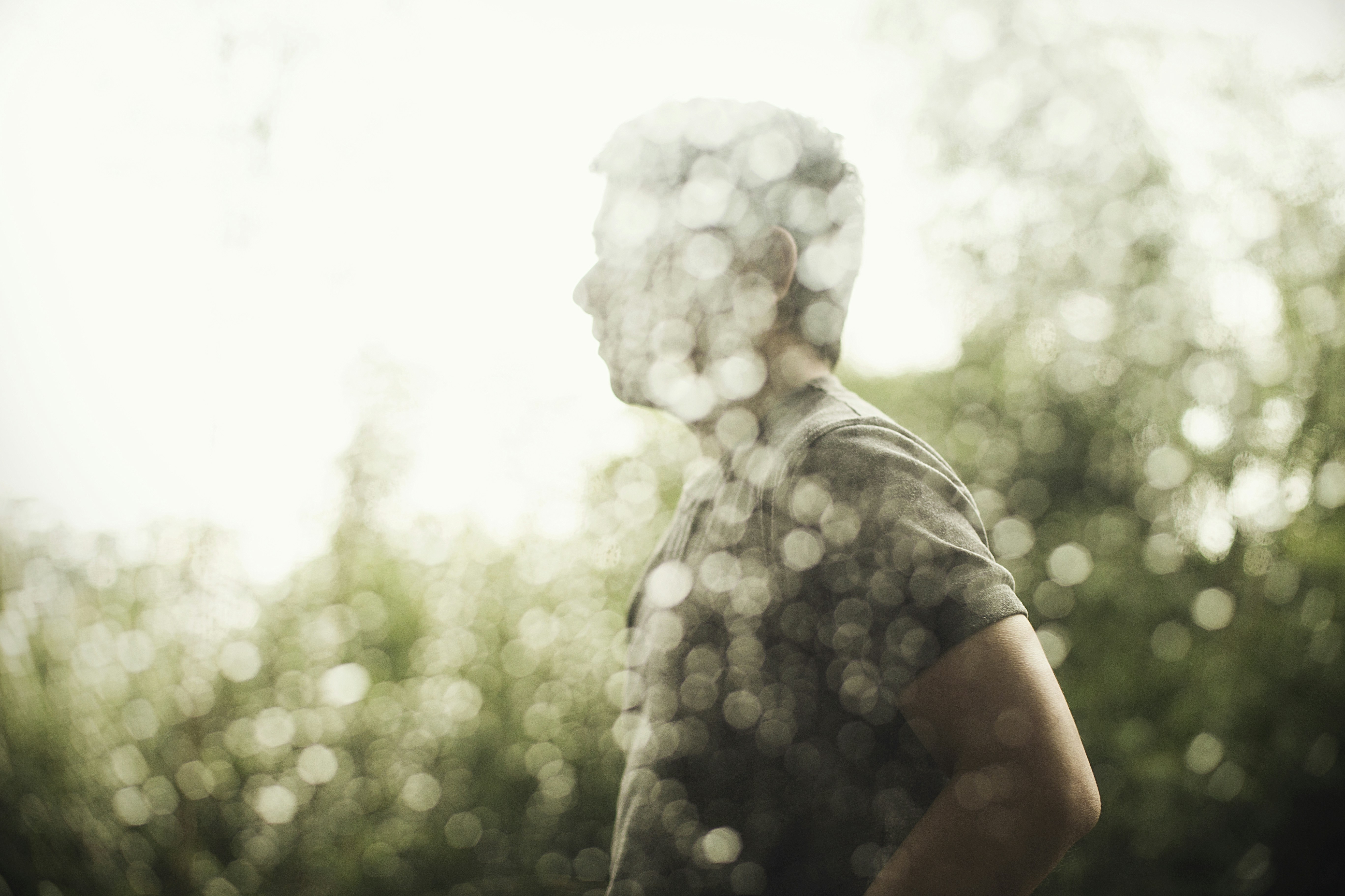 a hand holding a frozen ice cube