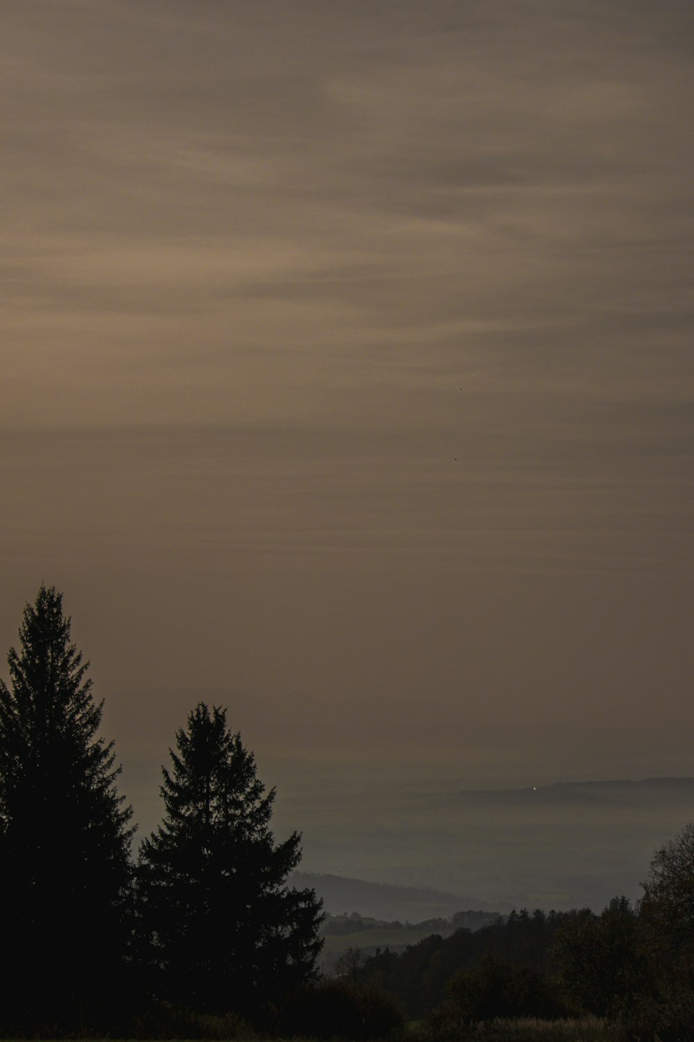 a view of a foggy landscape