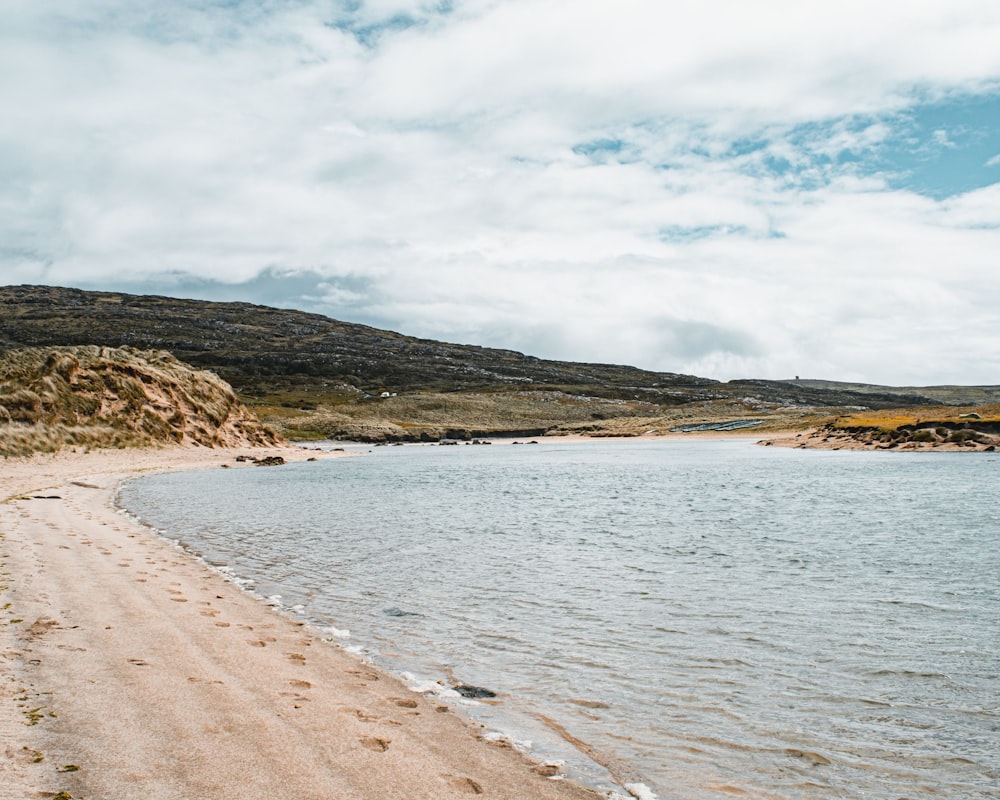 a beach with a body of water