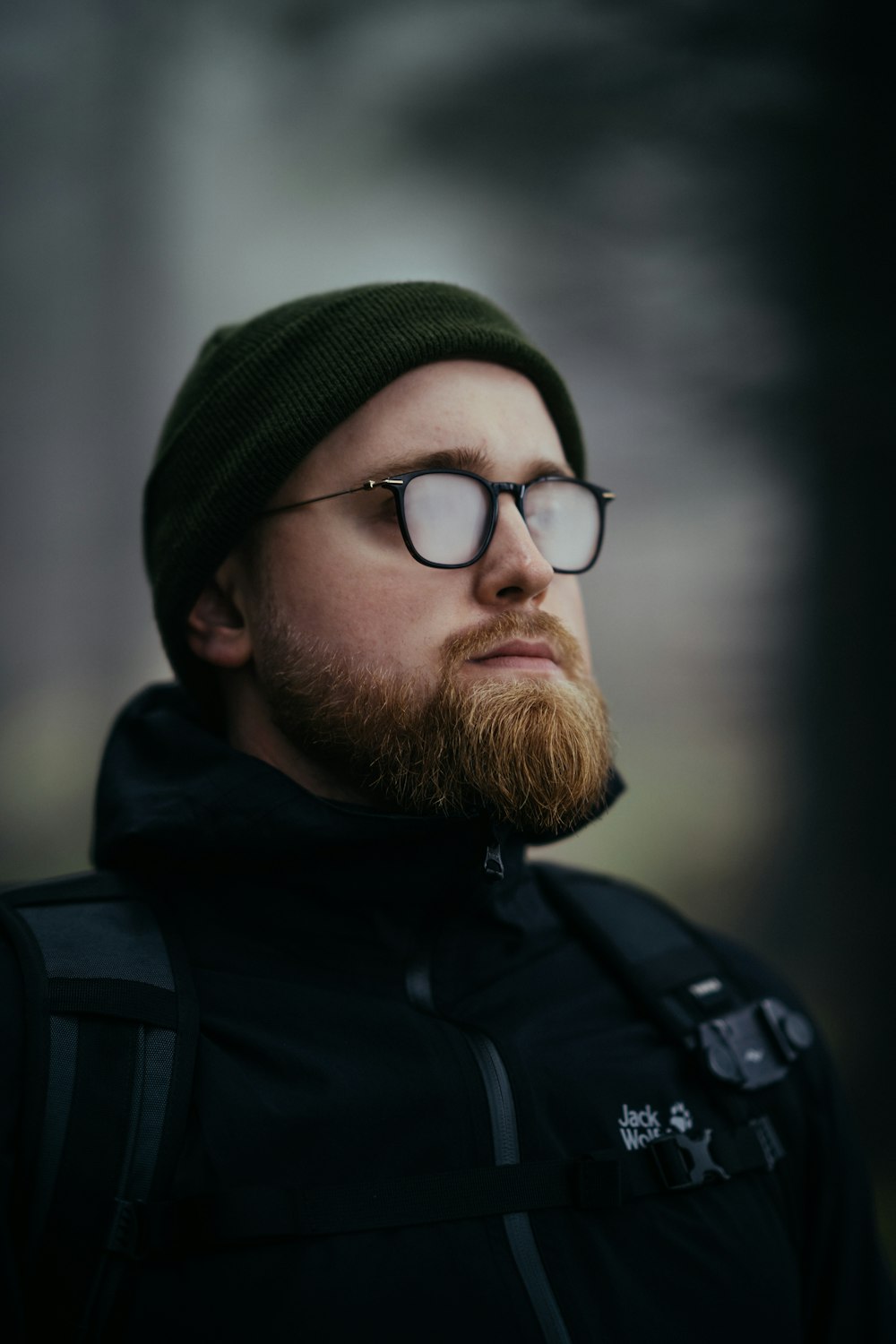 a man with a beard and glasses