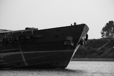 Close-up of a draft survey measurement being taken on a ship's hull.