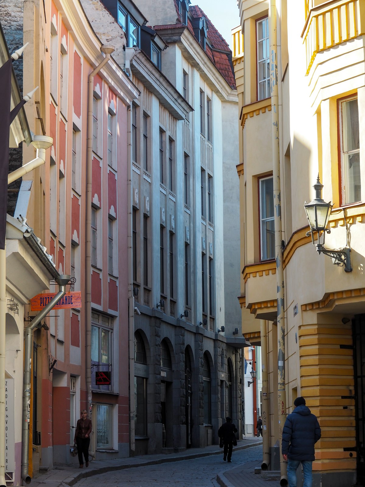 Kalamaja Tallinn wooden houses painted in pastel colours with cobbled street