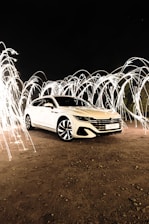 a car parked on a dirt road with sparks coming out of it