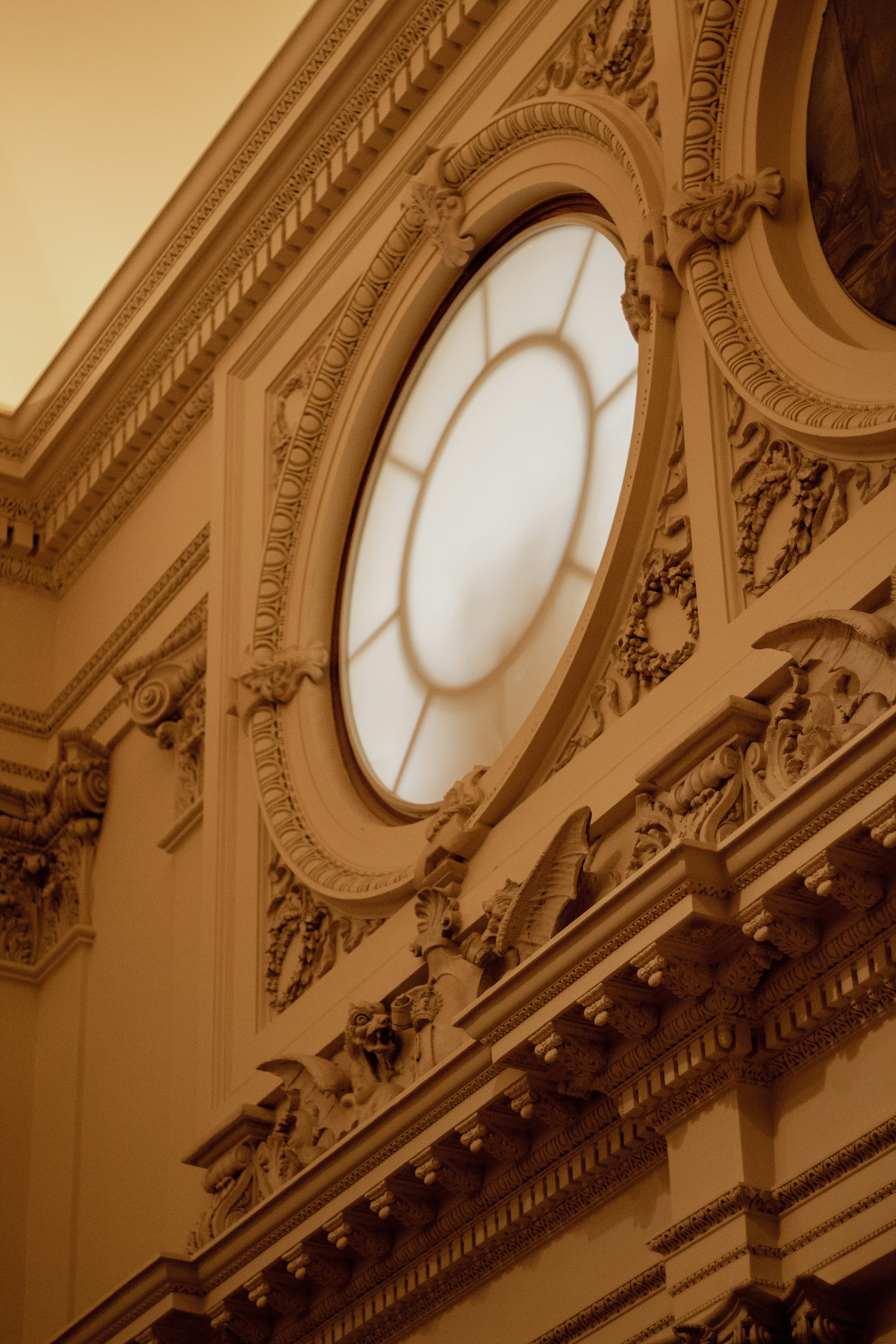 a circular white window on a building