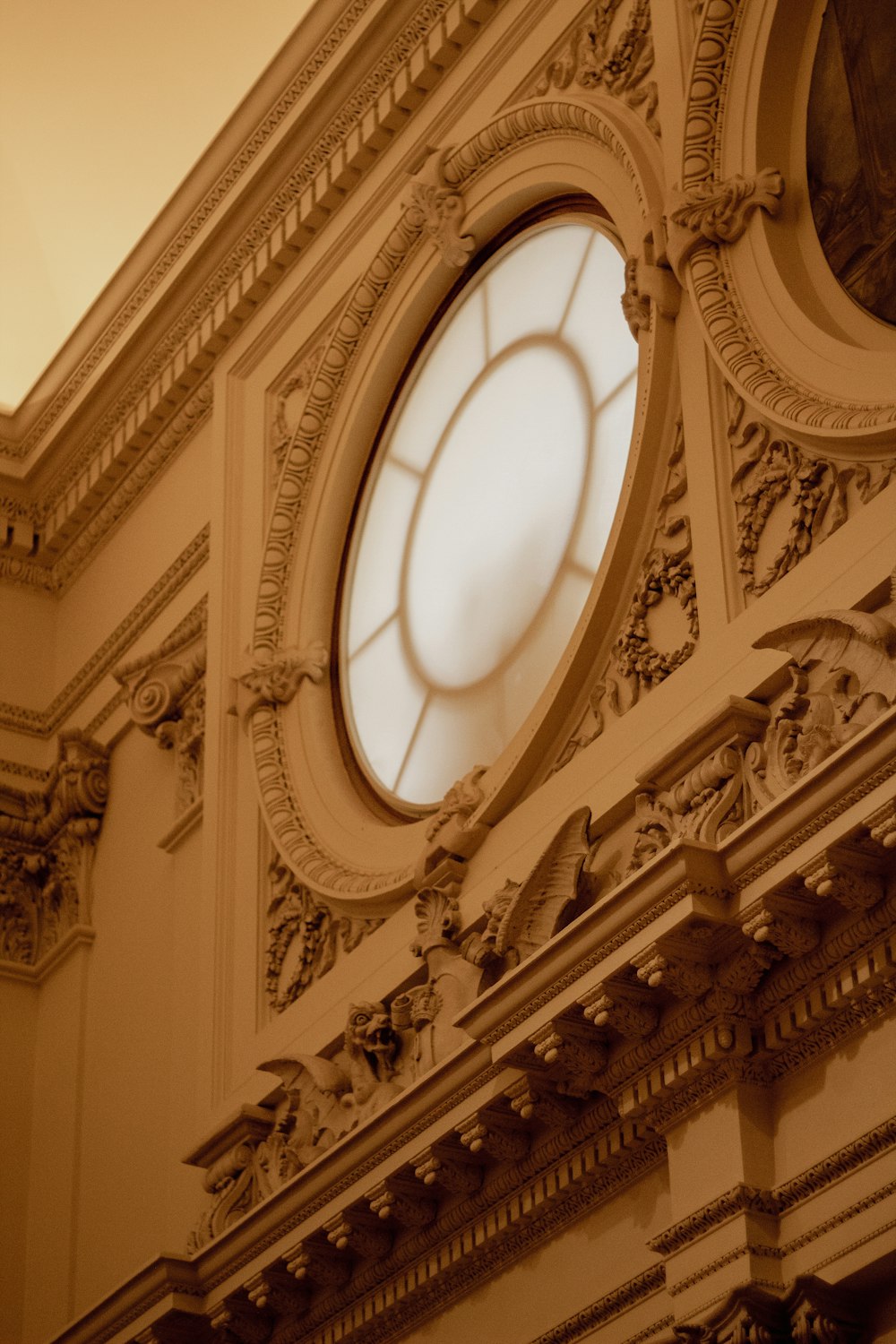 a circular white window on a building