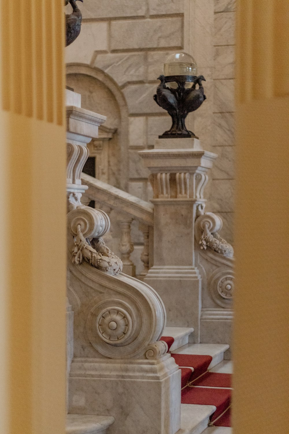 a stone pillar with a statue on top