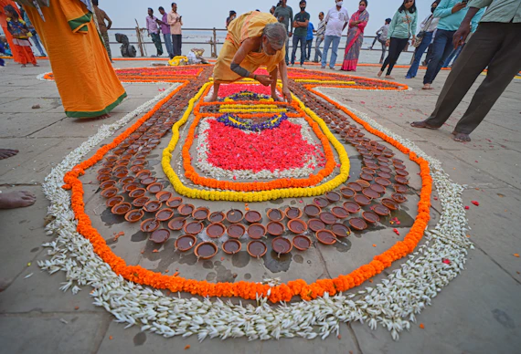 a person cutting a cake