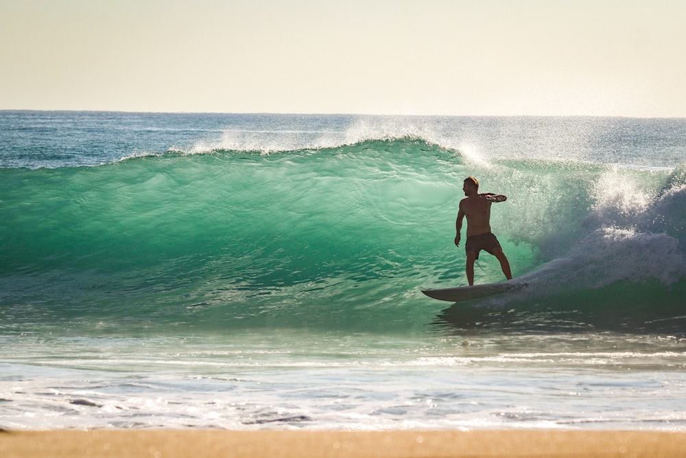 a man surfing on the waves