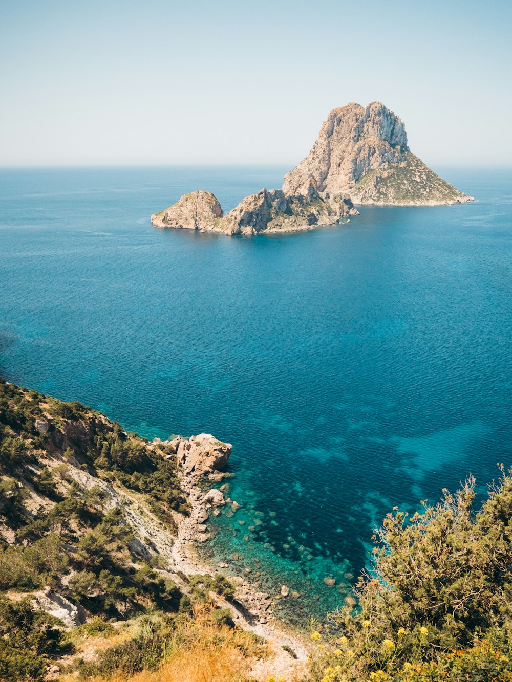 a rocky island in the ocean