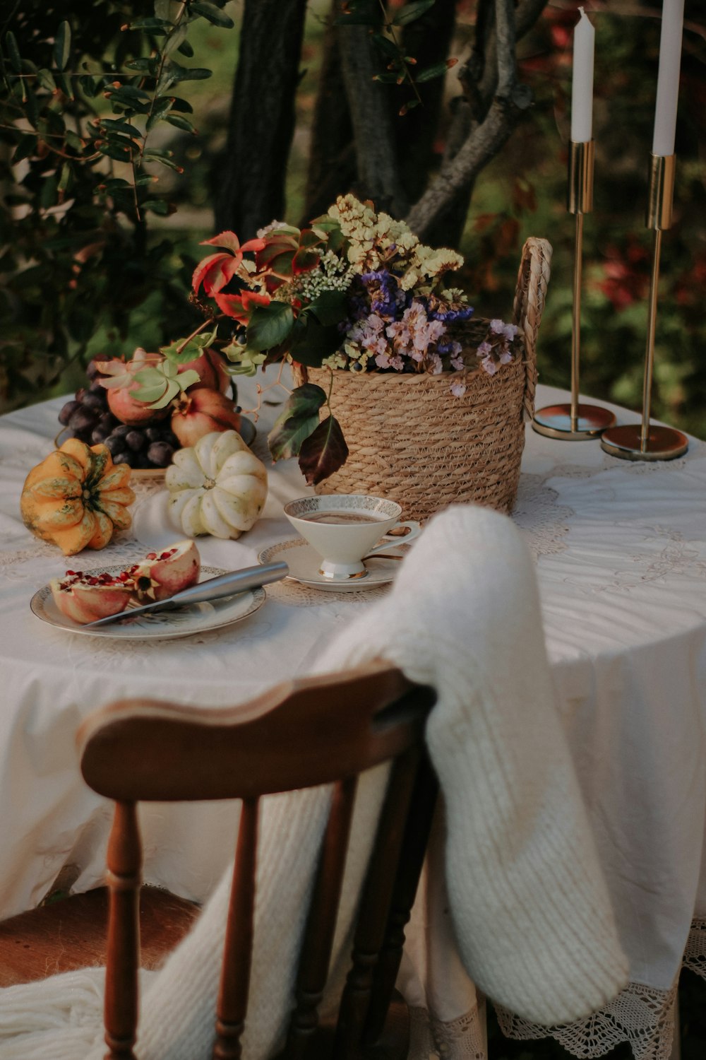 a table with a white cloth and flowers on it