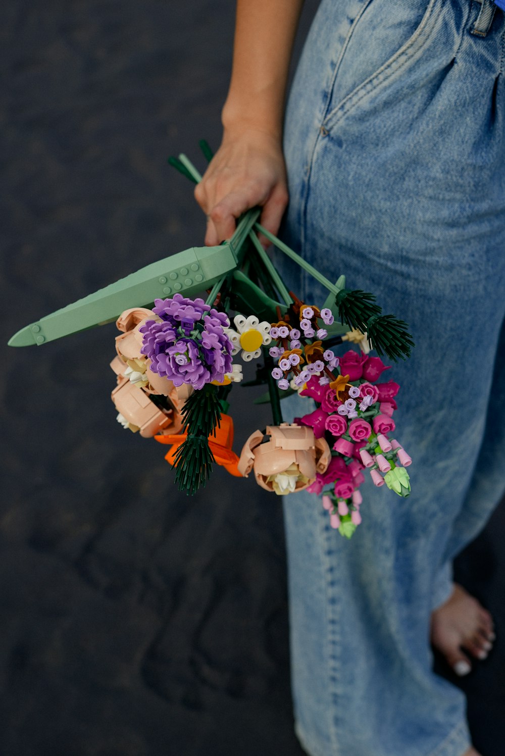 a person holding a bouquet of flowers