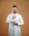 a man wearing a white robe