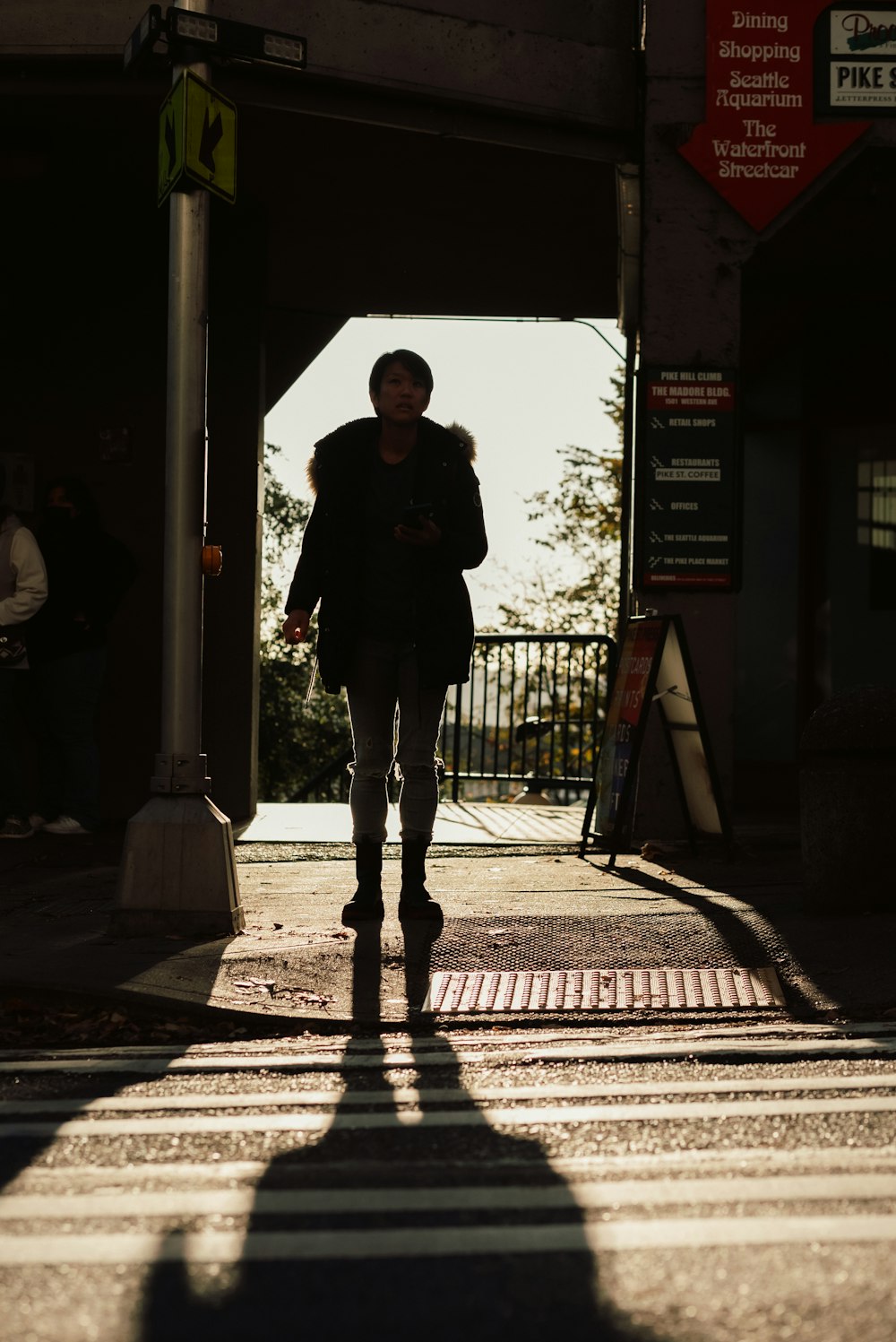 a person walking down a sidewalk