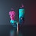 a blue and pink vase with a flower in it