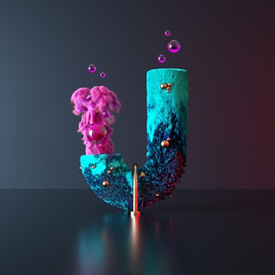 a blue and pink vase with a flower in it
