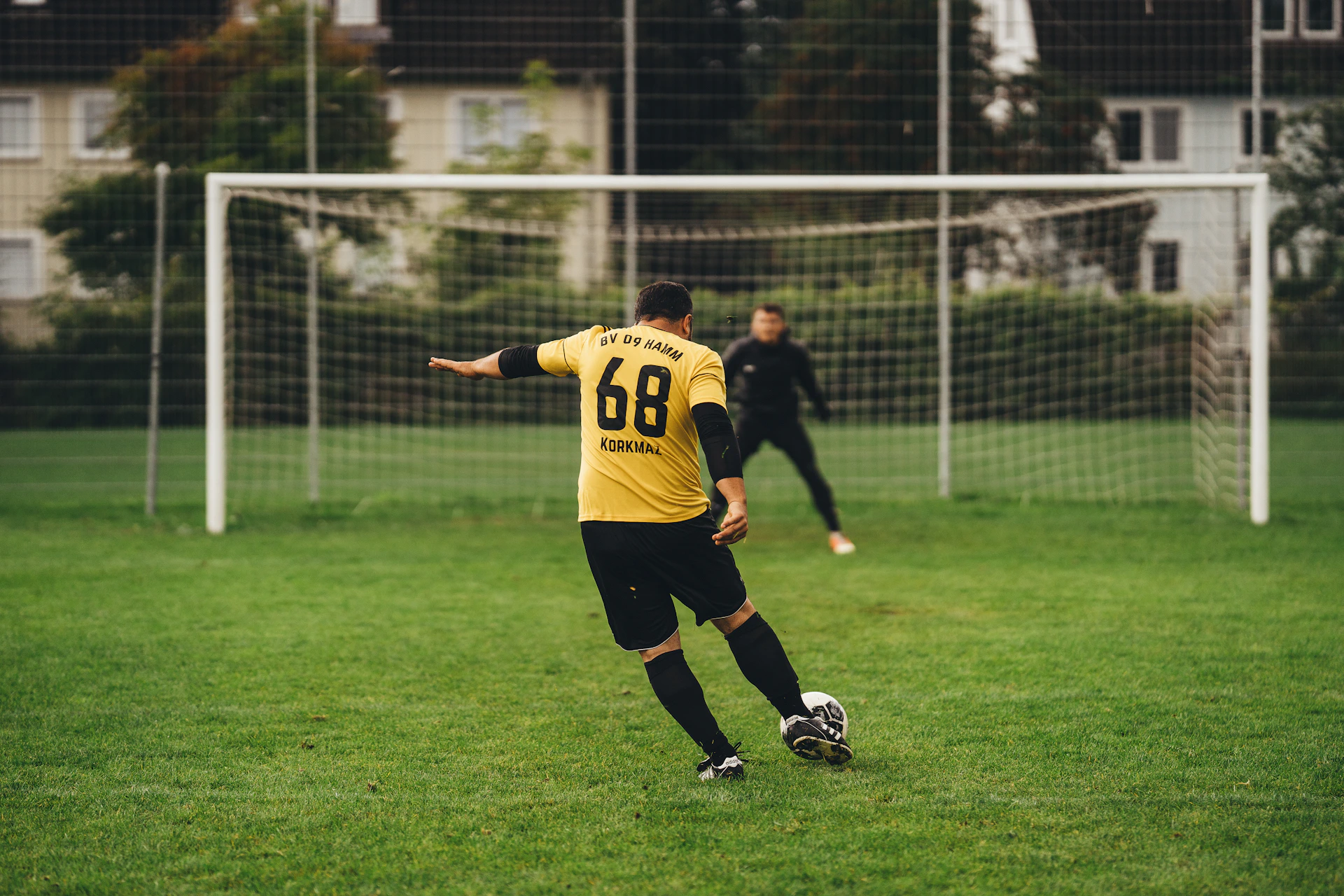 a person kicking a football ball