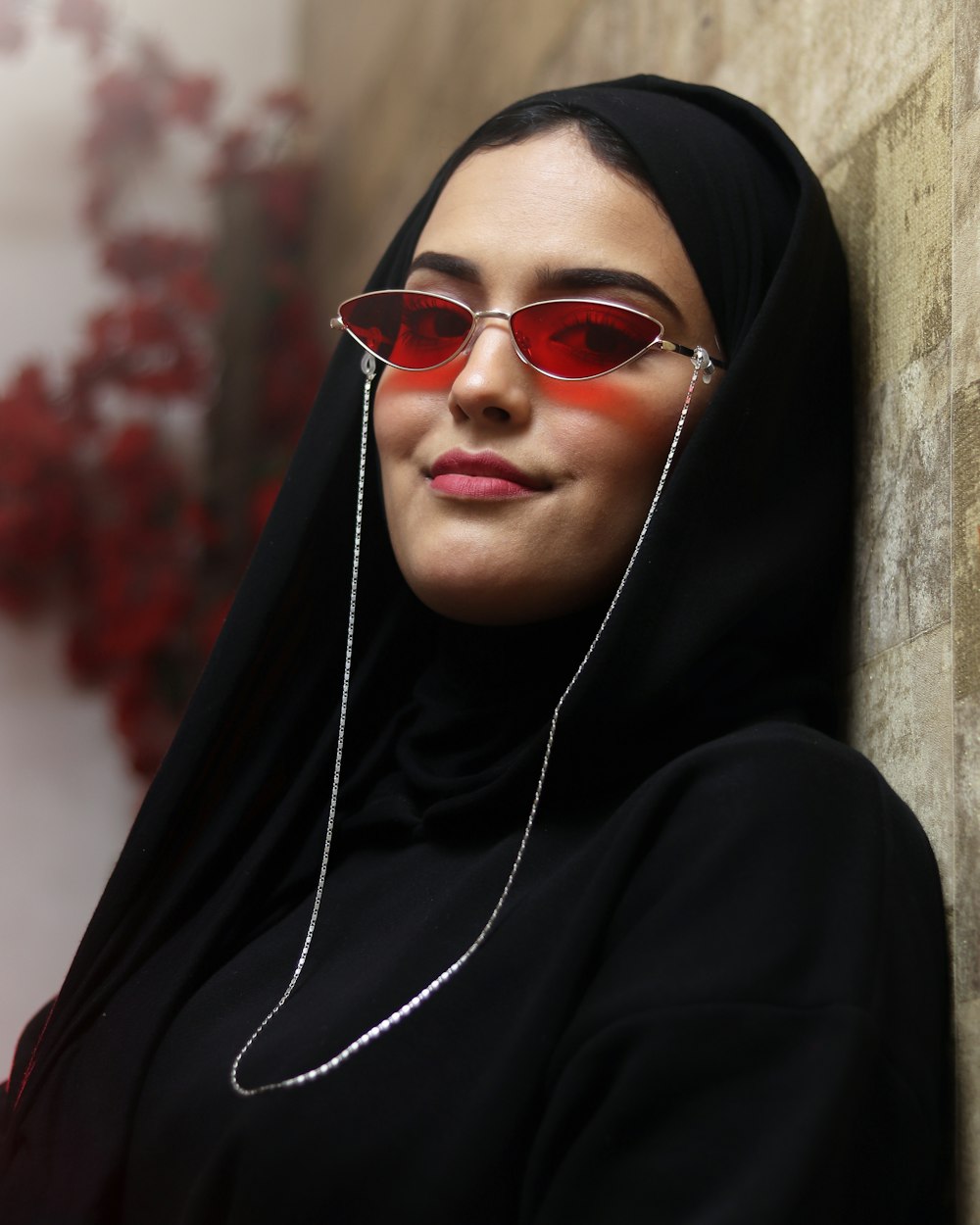 a person wearing a headscarf and sunglasses