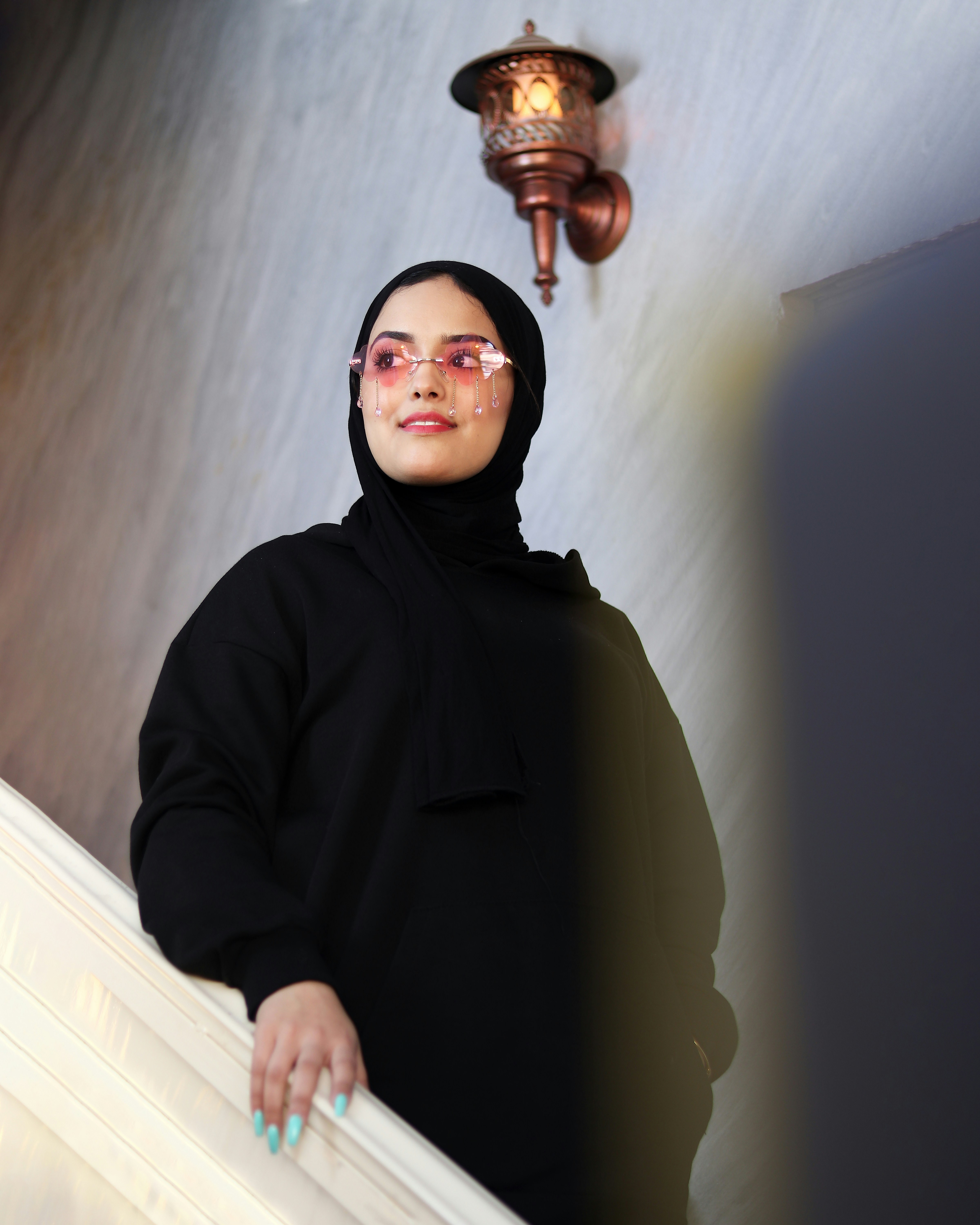 a person wearing a black robe and glasses