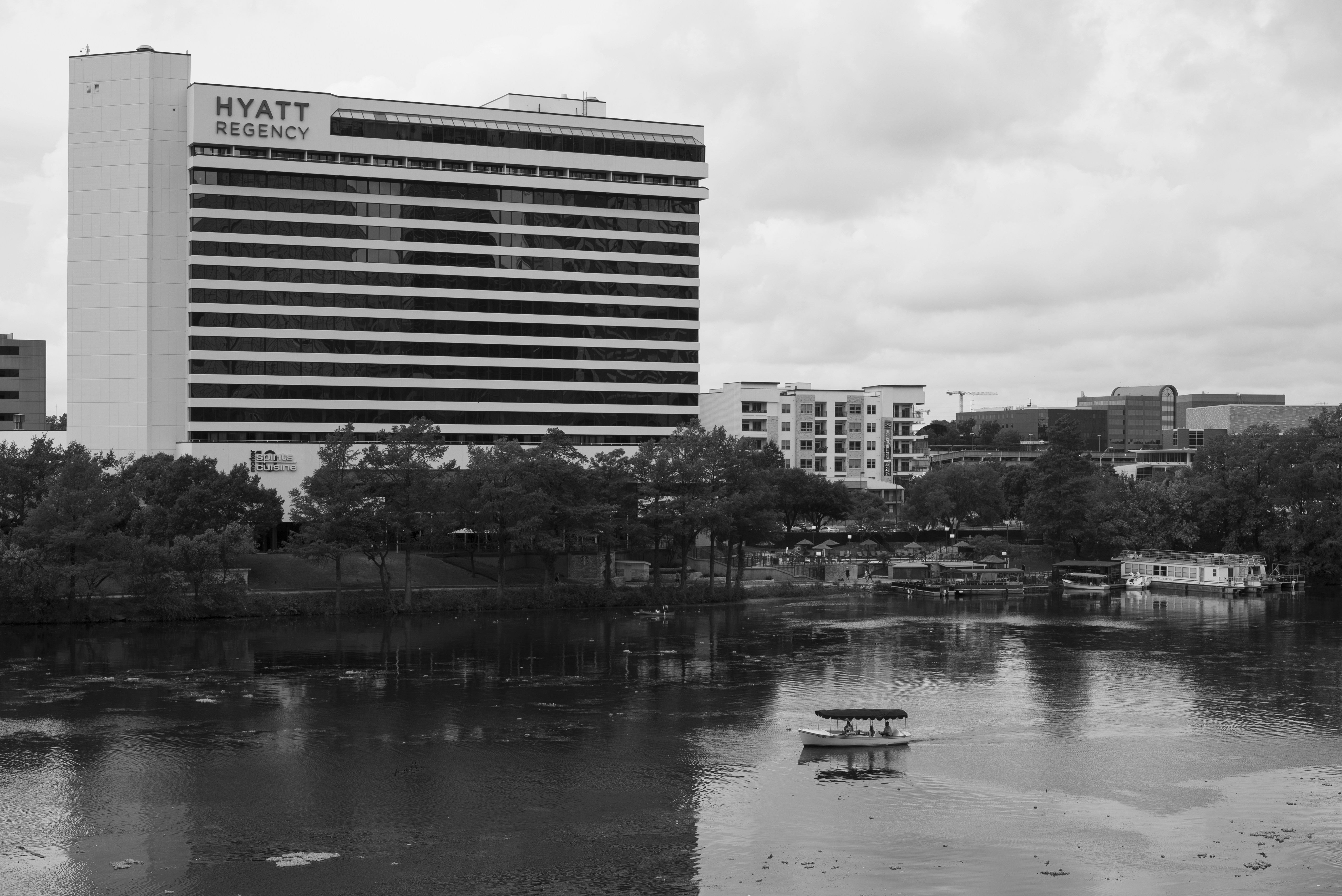 a body of water with buildings in the background