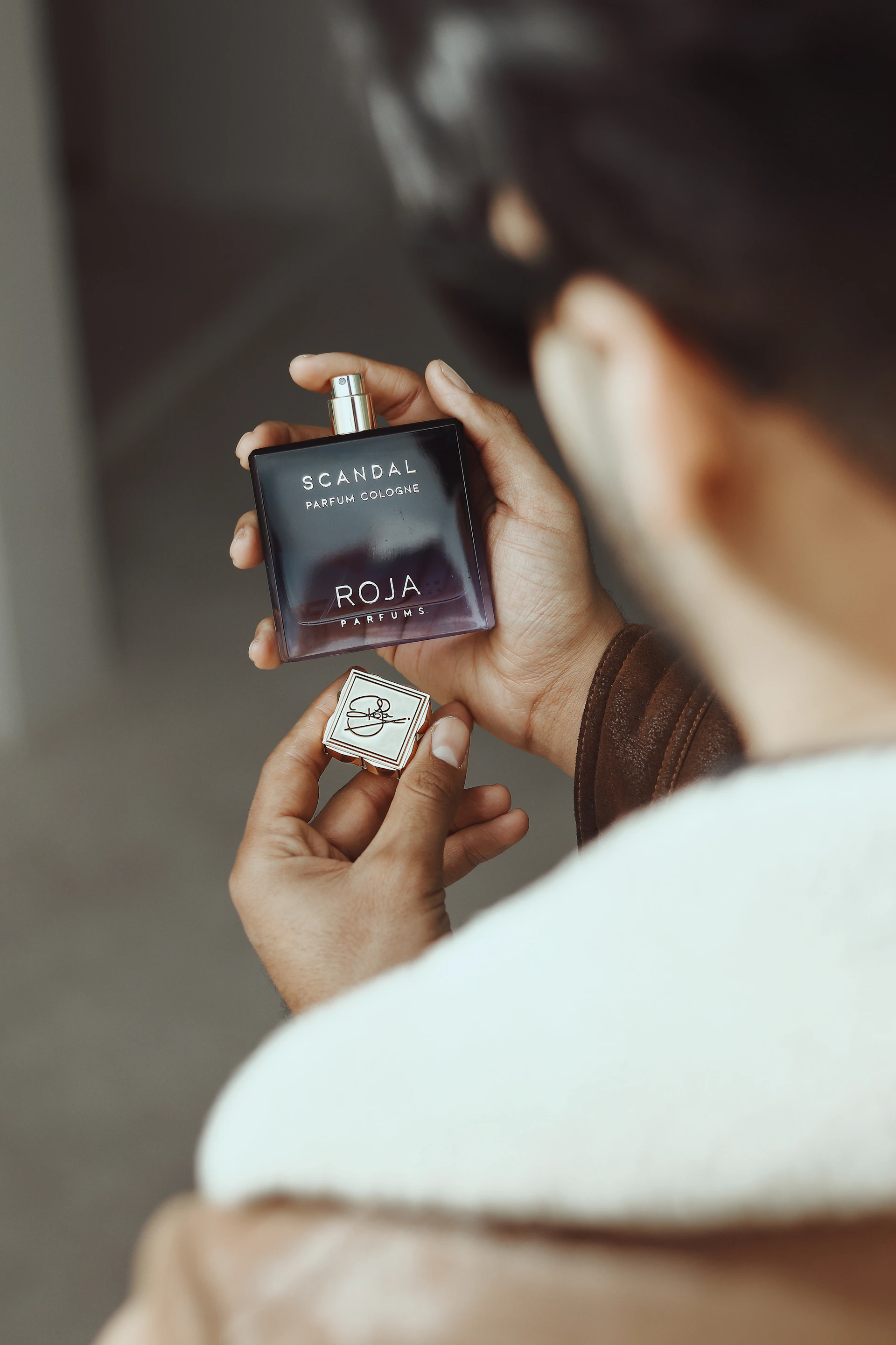 a person holding a small device